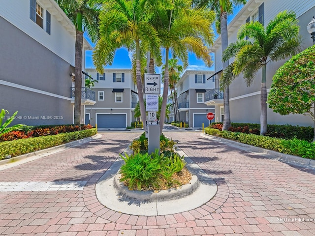 2249 NE 9th Ave, Wilton Manors, FL 33305 - view of property's community with decorative driveway and a residential view