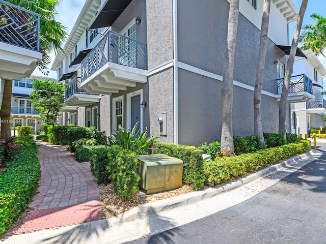 2249 NE 9th Ave, Wilton Manors, FL 33305 - view of side of home featuring a balcony and stucco siding