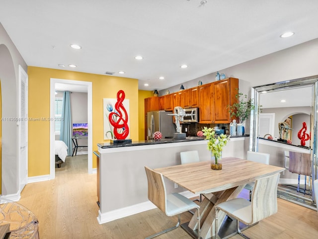 2249 NE 9th Ave, Wilton Manors, FL 33305 - dining room featuring light wood-style flooring and recessed lighting