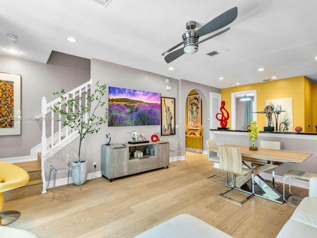 2249 NE 9th Ave, Wilton Manors, FL 33305 - living area featuring arched walkways, a ceiling fan, light wood finished floors, stairs, and recessed lighting