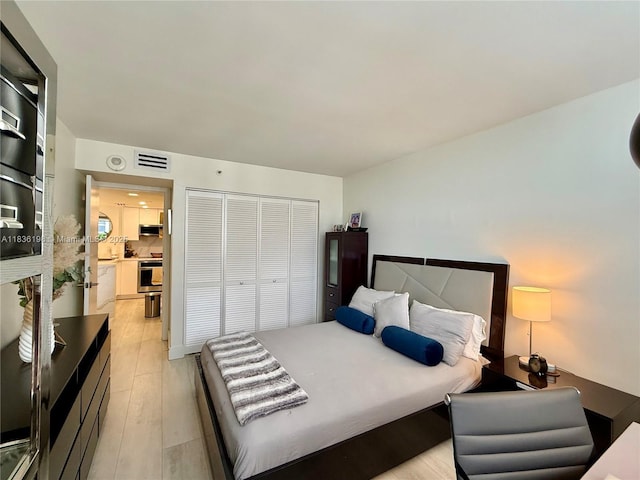 770 Claughton Island Dr Unit 1503, Miami, FL 33131 - bedroom with a closet and light wood-style floors
