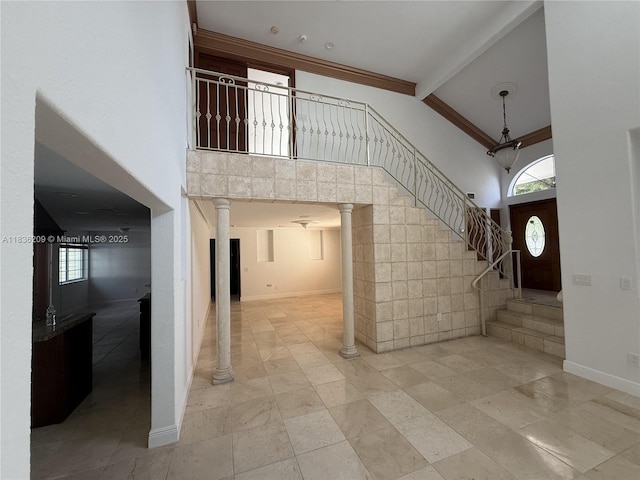 15051 SW 149th St, Miami, FL 33196 - entryway with high vaulted ceiling, beam ceiling, stairs, and ornate columns