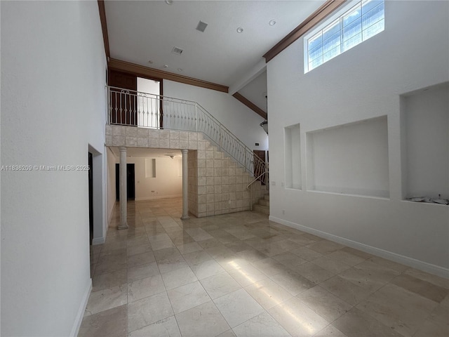 15051 SW 149th St, Miami, FL 33196 - unfurnished living room with a high ceiling, stairway, and crown molding