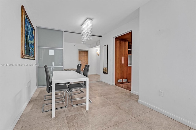 50 Biscayne Blvd Unit 601, Miami, FL 33132 - dining space featuring baseboards and light tile patterned flooring