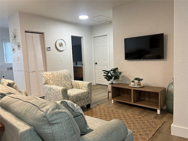 8921 NW 17th Ave, Miami, FL 33147 - living area with wood finished floors and a textured wall