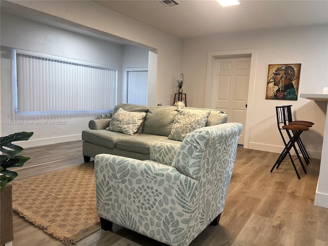 8921 NW 17th Ave, Miami, FL 33147 - living room with baseboards and wood finished floors