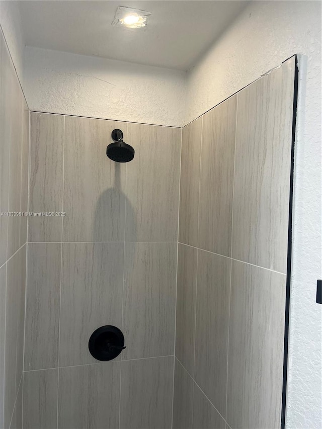 8921 NW 17th Ave, Miami, FL 33147 - bathroom view of a tile shower and a textured wall