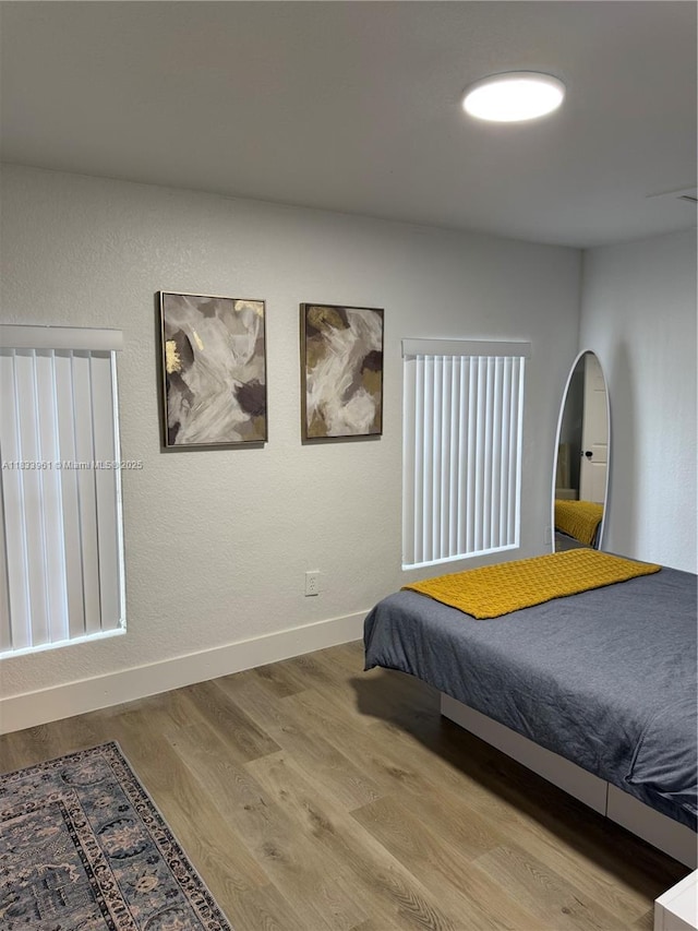 8921 NW 17th Ave, Miami, FL 33147 - bedroom with wood finished floors and baseboards