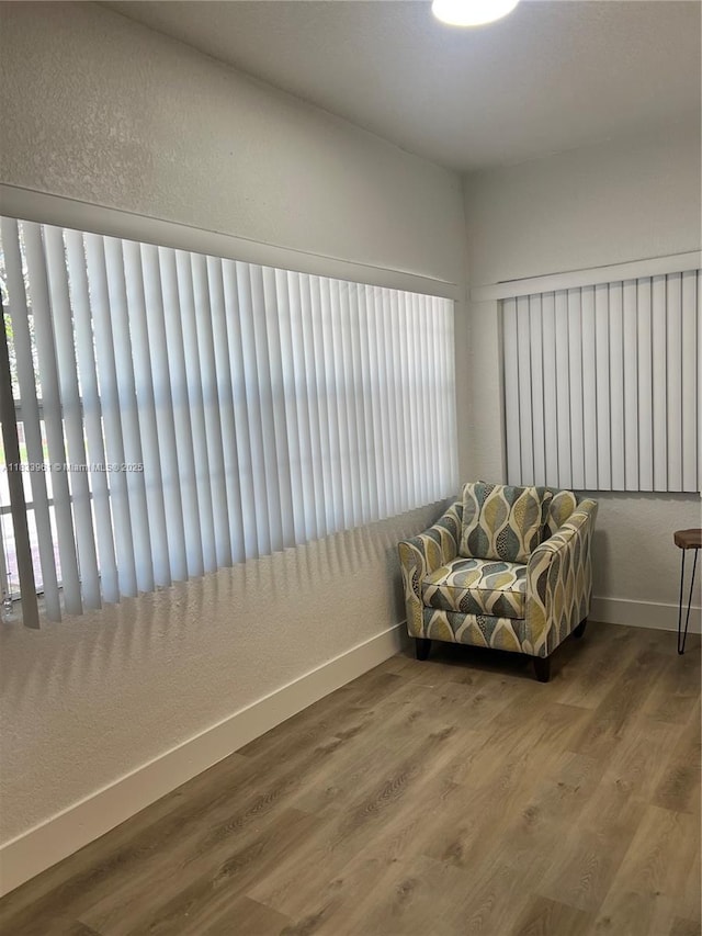 8921 NW 17th Ave, Miami, FL 33147 - sitting room featuring baseboards and wood finished floors