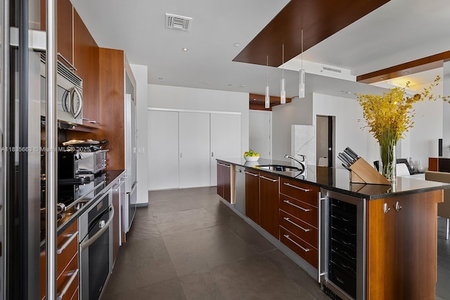 901 Brickell Key Blvd Unit 3607, Miami, FL 33131 - kitchen with wine cooler, modern cabinets, a large island, stainless steel appliances, and recessed lighting