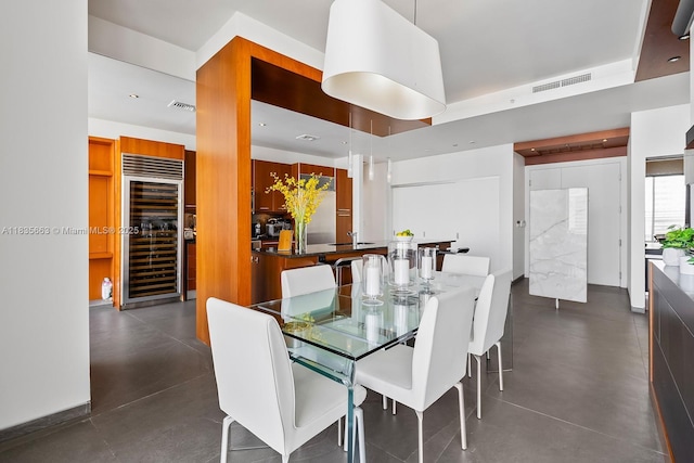 901 Brickell Key Blvd Unit 3607, Miami, FL 33131 - dining room featuring beverage cooler and finished concrete floors