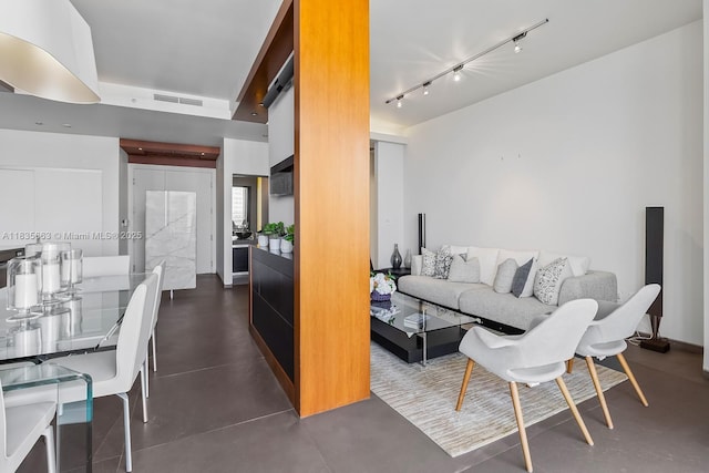 901 Brickell Key Blvd Unit 3607, Miami, FL 33131 - living area featuring rail lighting and concrete flooring