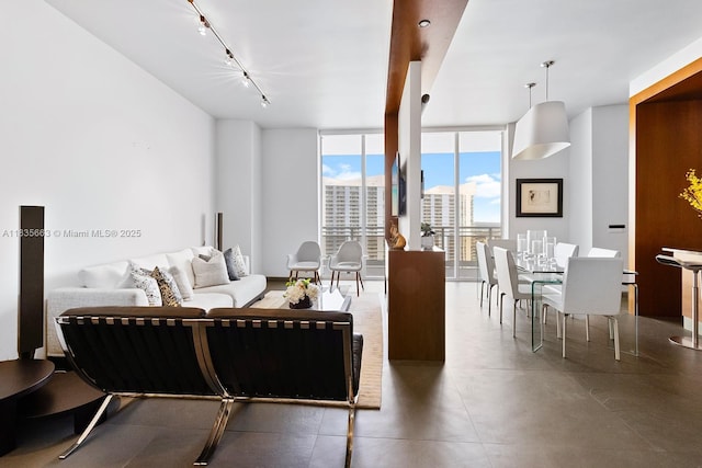 901 Brickell Key Blvd Unit 3607, Miami, FL 33131 - living area with track lighting, expansive windows, and finished concrete flooring