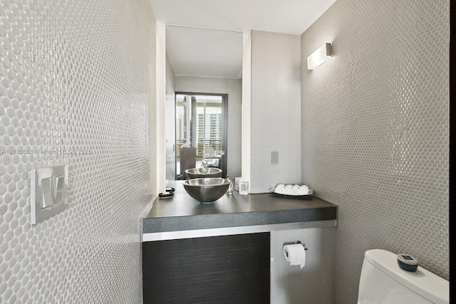901 Brickell Key Blvd Unit 3607, Miami, FL 33131 - bathroom with vanity and tile walls