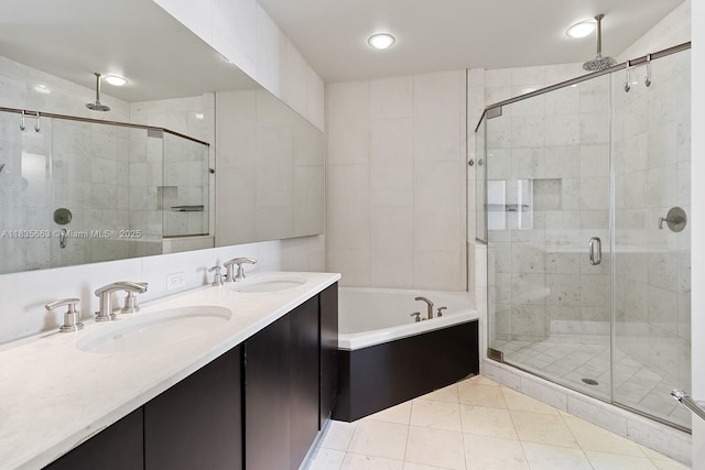 901 Brickell Key Blvd Unit 3607, Miami, FL 33131 - bathroom featuring a stall shower, a garden tub, tile patterned flooring, double vanity, and recessed lighting
