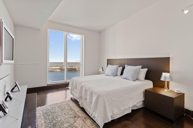 901 Brickell Key Blvd Unit 3607, Miami, FL 33131 - bedroom with hardwood / wood-style floors and a water view