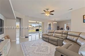 1851 Soaring Hights Cir, Orlando, FL 32837 - living area featuring a ceiling fan and a chandelier