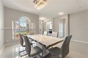1851 Soaring Hights Cir, Orlando, FL 32837 - dining room with plenty of natural light and a chandelier
