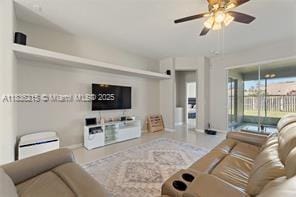 1851 Soaring Hights Cir, Orlando, FL 32837 - living area with ceiling fan and baseboards