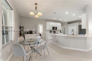 1851 Soaring Hights Cir, Orlando, FL 32837 - dining room with a chandelier and recessed lighting