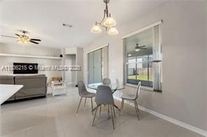 1851 Soaring Hights Cir, Orlando, FL 32837 - dining space featuring ceiling fan and a chandelier