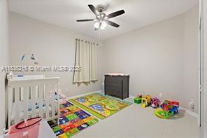 1851 Soaring Hights Cir, Orlando, FL 32837 - bedroom featuring radiator and ceiling fan