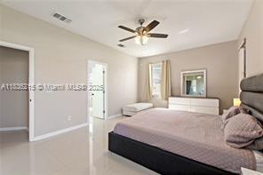 1851 Soaring Hights Cir, Orlando, FL 32837 - bedroom featuring baseboards and a ceiling fan