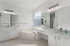 1851 Soaring Hights Cir, Orlando, FL 32837 - bathroom featuring a garden tub and two vanities