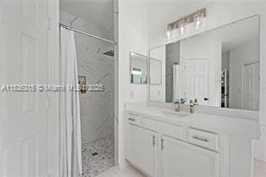 1851 Soaring Hights Cir, Orlando, FL 32837 - bathroom with a shower with curtain and vanity