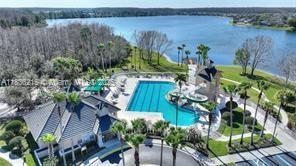 1851 Soaring Hights Cir, Orlando, FL 32837 - aerial view of a pool and a large body of water