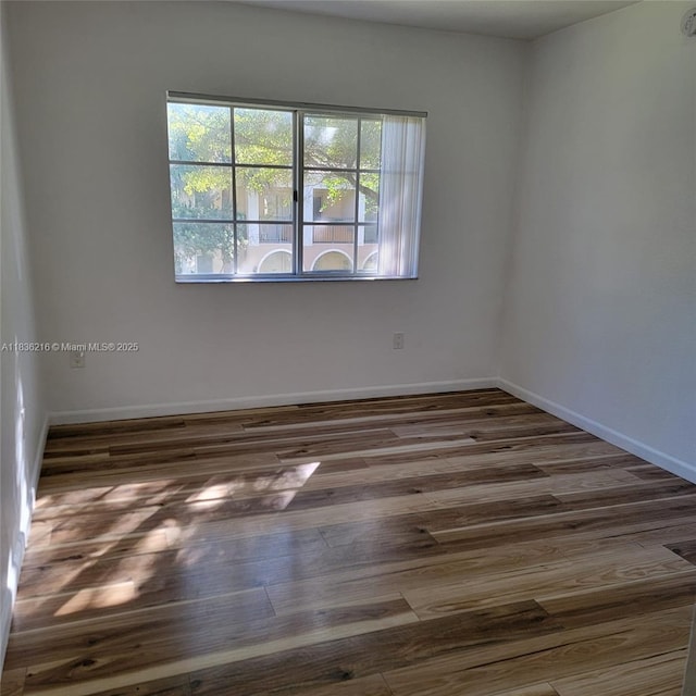 2564 Centergate Dr Unit 204, Miramar, FL 33025 - unfurnished room featuring wood finished floors and baseboards