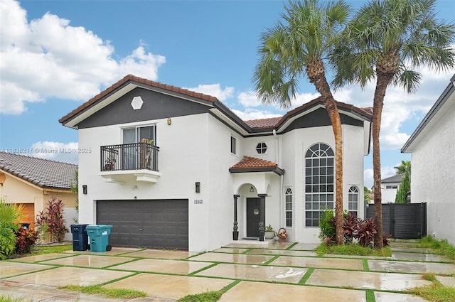 11652 SW 142nd Ct, Miami, FL 33186 - mediterranean / spanish-style house featuring a balcony, a tiled roof, stucco siding, and a garage