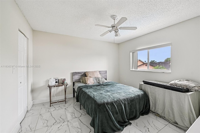 11652 SW 142nd Ct, Miami, FL 33186 - bedroom featuring marble finish floors, a textured ceiling, and ceiling fan