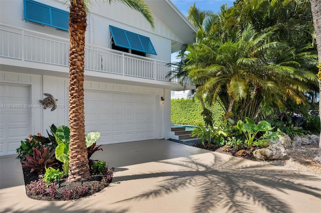 126 Villa Bella Dr, Islamorada, FL 33036 - view of front of home with a balcony, a garage, and driveway