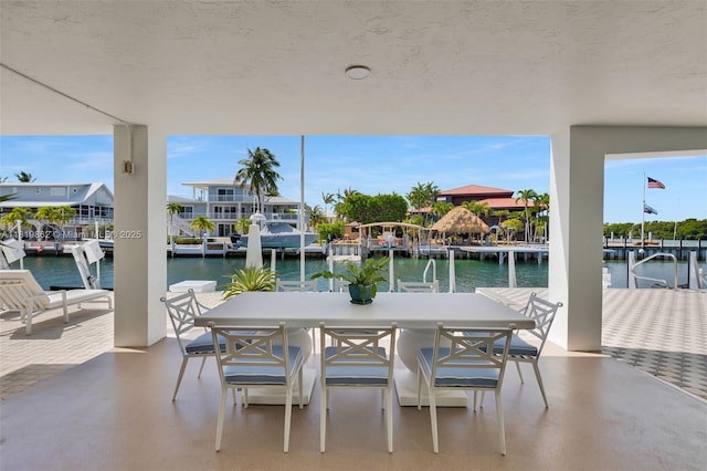126 Villa Bella Dr, Islamorada, FL 33036 - view of patio featuring a boat dock and a water view