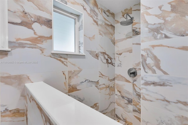 126 Villa Bella Dr, Islamorada, FL 33036 - bathroom featuring a tile shower and tile walls