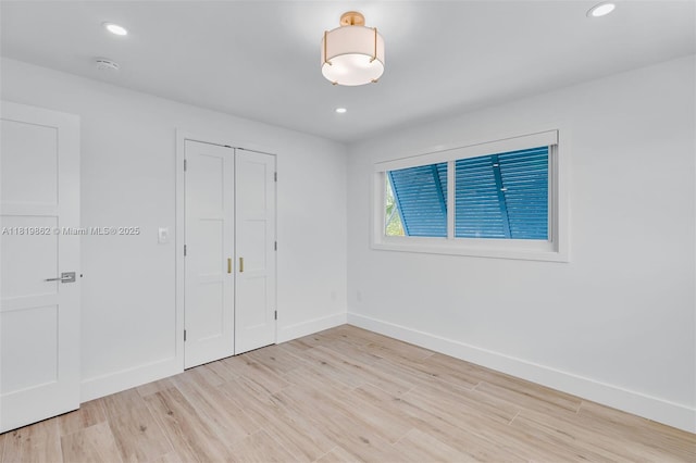 126 Villa Bella Dr, Islamorada, FL 33036 - unfurnished bedroom featuring light wood-style floors, recessed lighting, and a closet