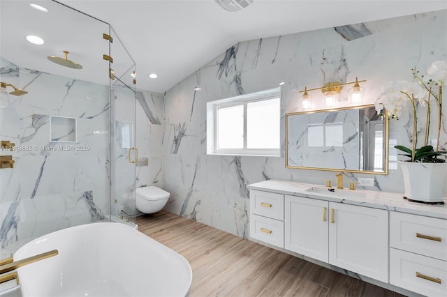 126 Villa Bella Dr, Islamorada, FL 33036 - full bathroom featuring vanity, a freestanding bath, a marble finish shower, wood finished floors, and recessed lighting