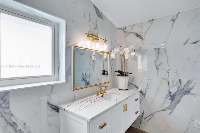 126 Villa Bella Dr, Islamorada, FL 33036 - bathroom featuring vanity, healthy amount of natural light, tile walls, and vaulted ceiling