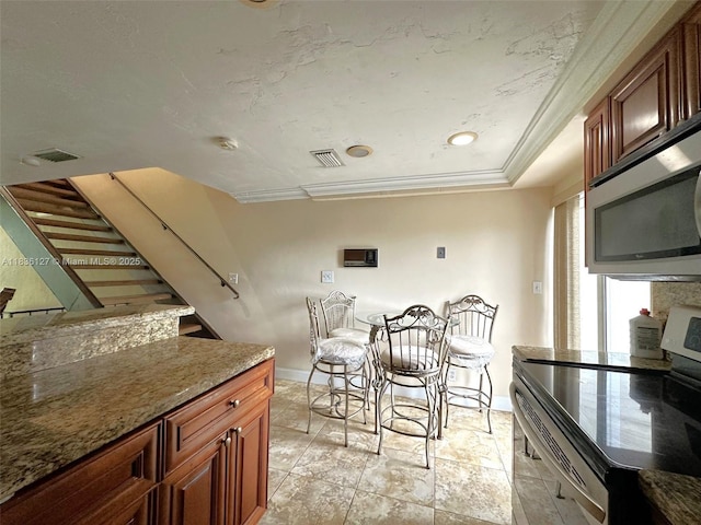 6707 Brookline Dr Unit 6707, Hialeah, FL 33015 - dining room featuring baseboards and crown molding