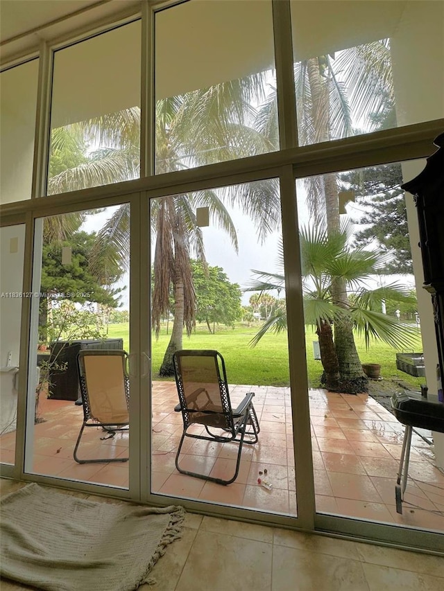 6707 Brookline Dr Unit 6707, Hialeah, FL 33015 - doorway featuring tile patterned floors, plenty of natural light, and a water view