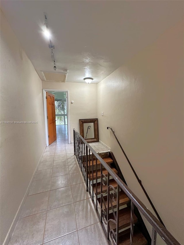 6707 Brookline Dr Unit 6707, Hialeah, FL 33015 - corridor featuring light tile patterned floors, attic access, and an upstairs landing
