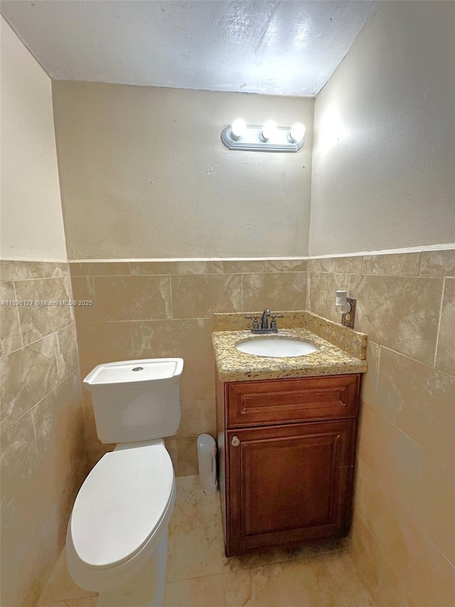 6707 Brookline Dr Unit 6707, Hialeah, FL 33015 - bathroom with tile walls, vanity, and a wainscoted wall