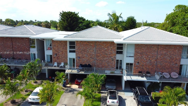 6707 Brookline Dr Unit 6707, Hialeah, FL 33015 - view of apartment building / complex featuring covered parking