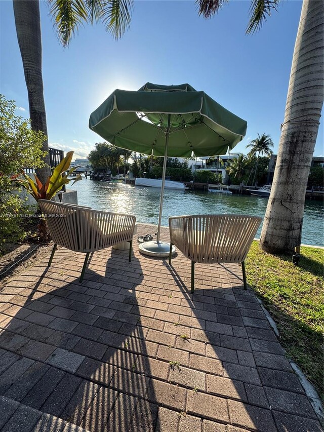 4780 Pine Tree Dr Unit U-2, Miami Beach, FL 33140 - view of patio / terrace with a water view
