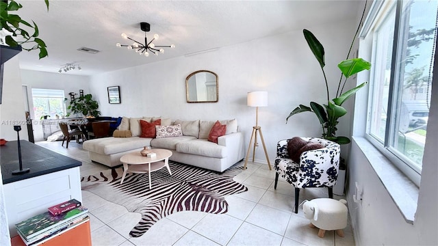 8449 NW 4th Ave Unit 8449, Miami, FL 33150 - living room with light tile patterned floors and a chandelier