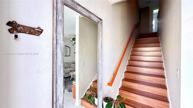 8449 NW 4th Ave Unit 8449, Miami, FL 33150 - staircase with a textured wall and tile patterned floors