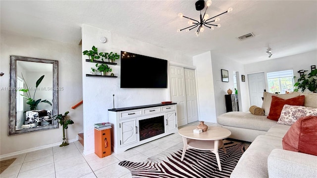 8449 NW 4th Ave Unit 8449, Miami, FL 33150 - living room with light tile patterned floors and a chandelier