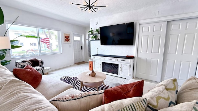 8449 NW 4th Ave Unit 8449, Miami, FL 33150 - living area featuring a textured ceiling, light tile patterned floors, and a chandelier