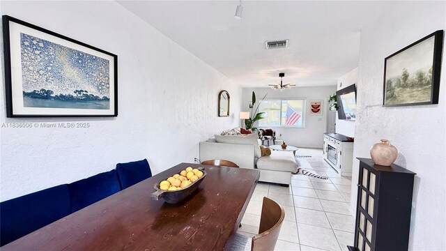 8449 NW 4th Ave Unit 8449, Miami, FL 33150 - dining room featuring a textured wall and light tile patterned flooring